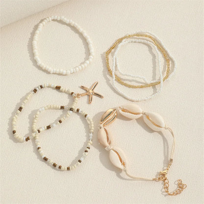 Coastal Beaded Bracelet Stack (7-Pack) | Starfish + Shell Charms (White/Gold)