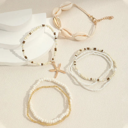 Coastal Beaded Bracelet Stack (7-Pack) | Starfish + Shell Charms (White/Gold)